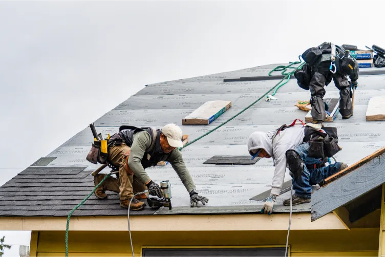 Build Strong Construction & Home Remodeling - Roofing - Crew Installing New Shingle Roof
